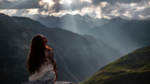 Woman looking out over mountains