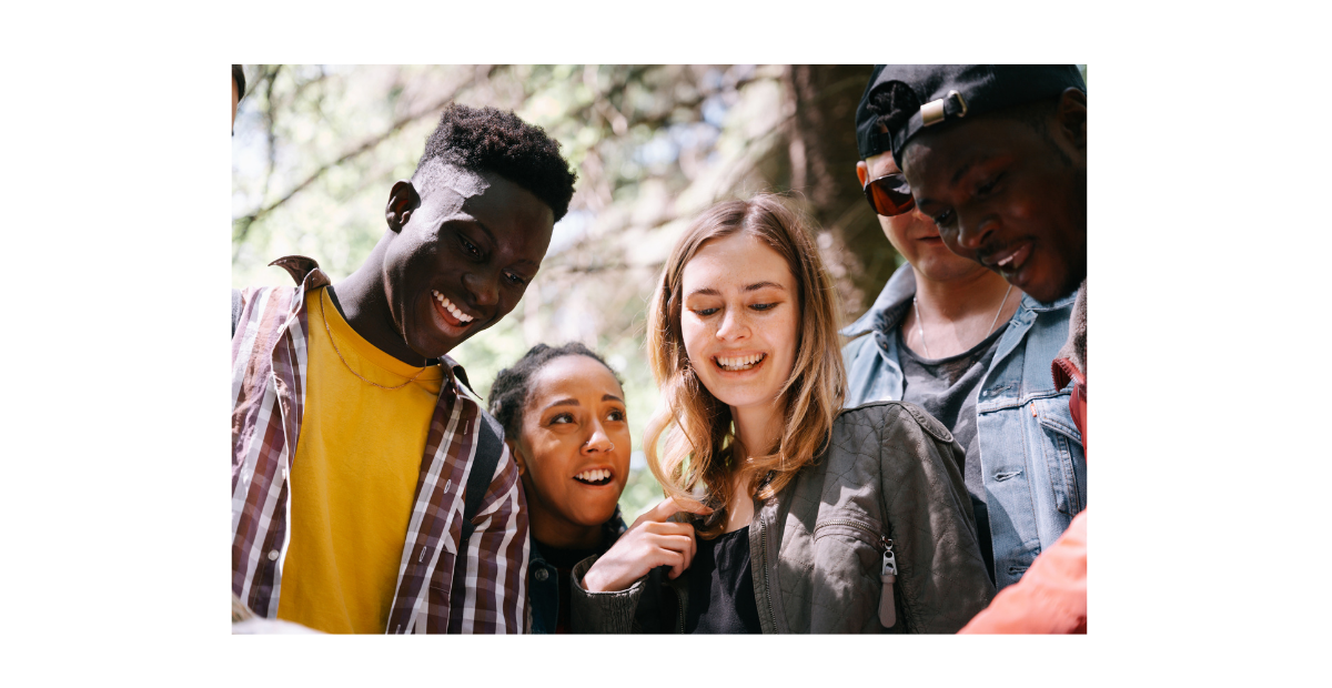 Young adults smiling at something off camera